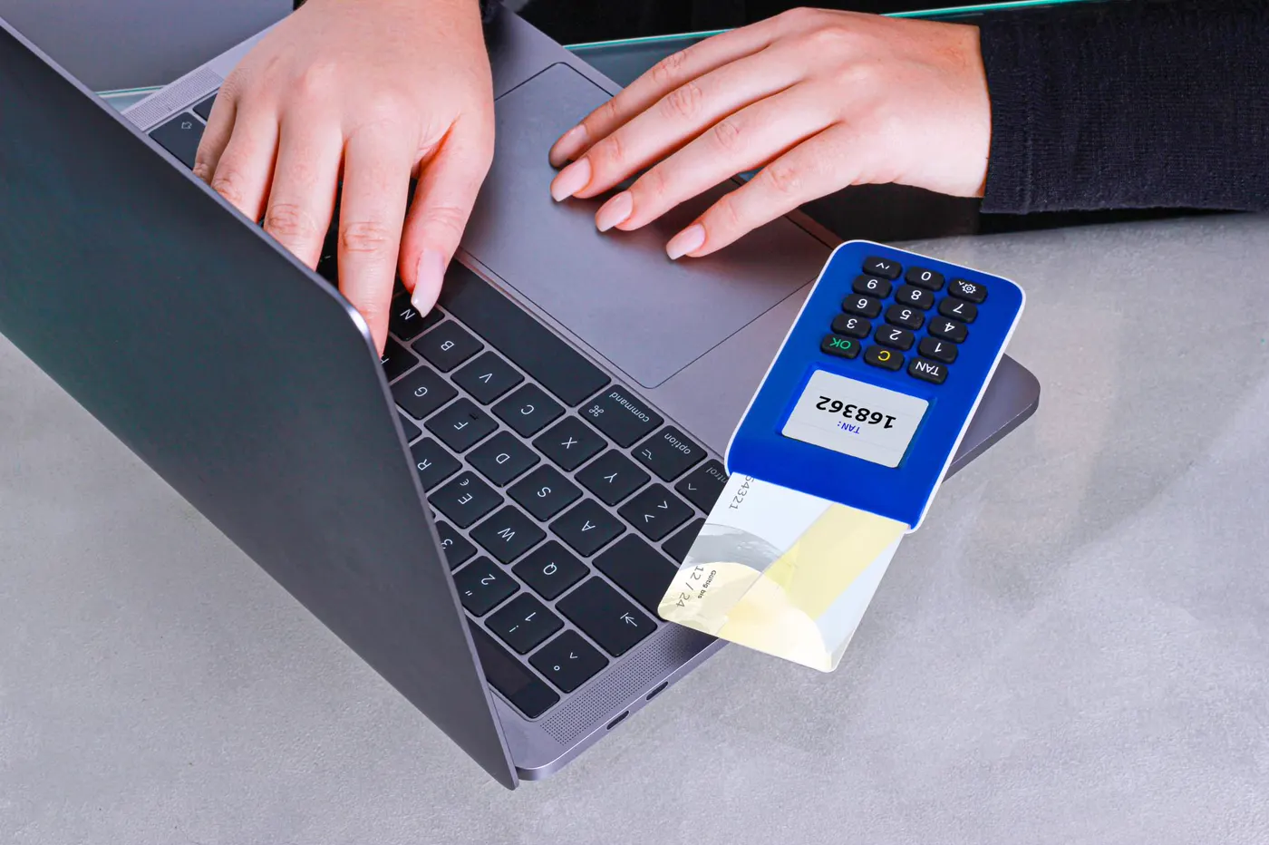 A person making an online payment on a laptop.